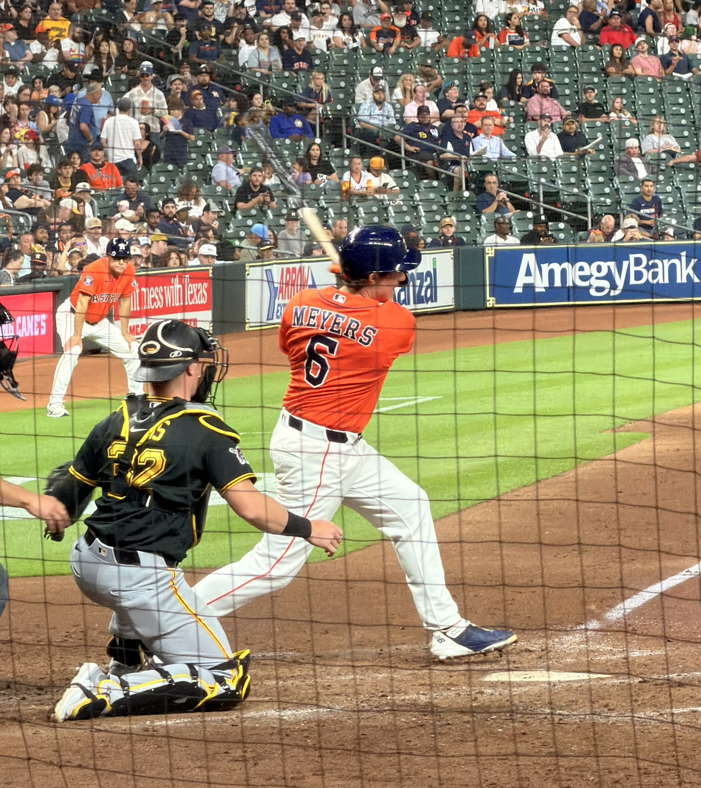 Jake Meyers swings at a pitch for the Astros at Daikin Park.
