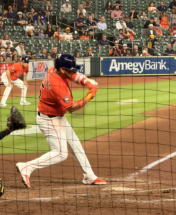 Isaac Paredes swings at a pitch during an Astros game at Daikin Park.