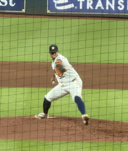 Bryan Abreu winding up for a pitch against the Atlanta Braves at Daikin Park.