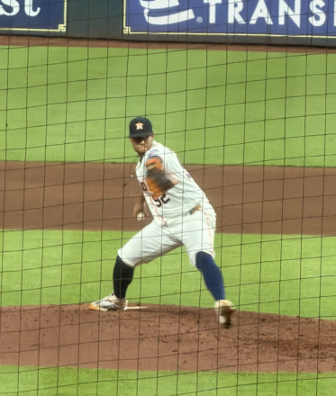 Bryan Abreu winding up for a pitch against the Atlanta Braves at Daikin Park.