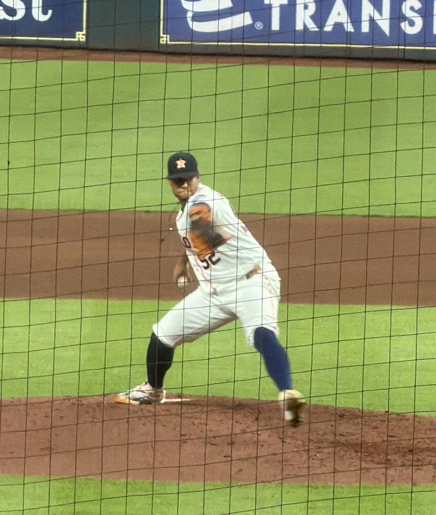 Bryan Abreu winding up for a pitch against the Atlanta Braves at Daikin Park.