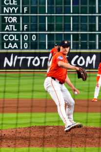 Bryan King delivers a pitch for the Astros at Daikin Park.