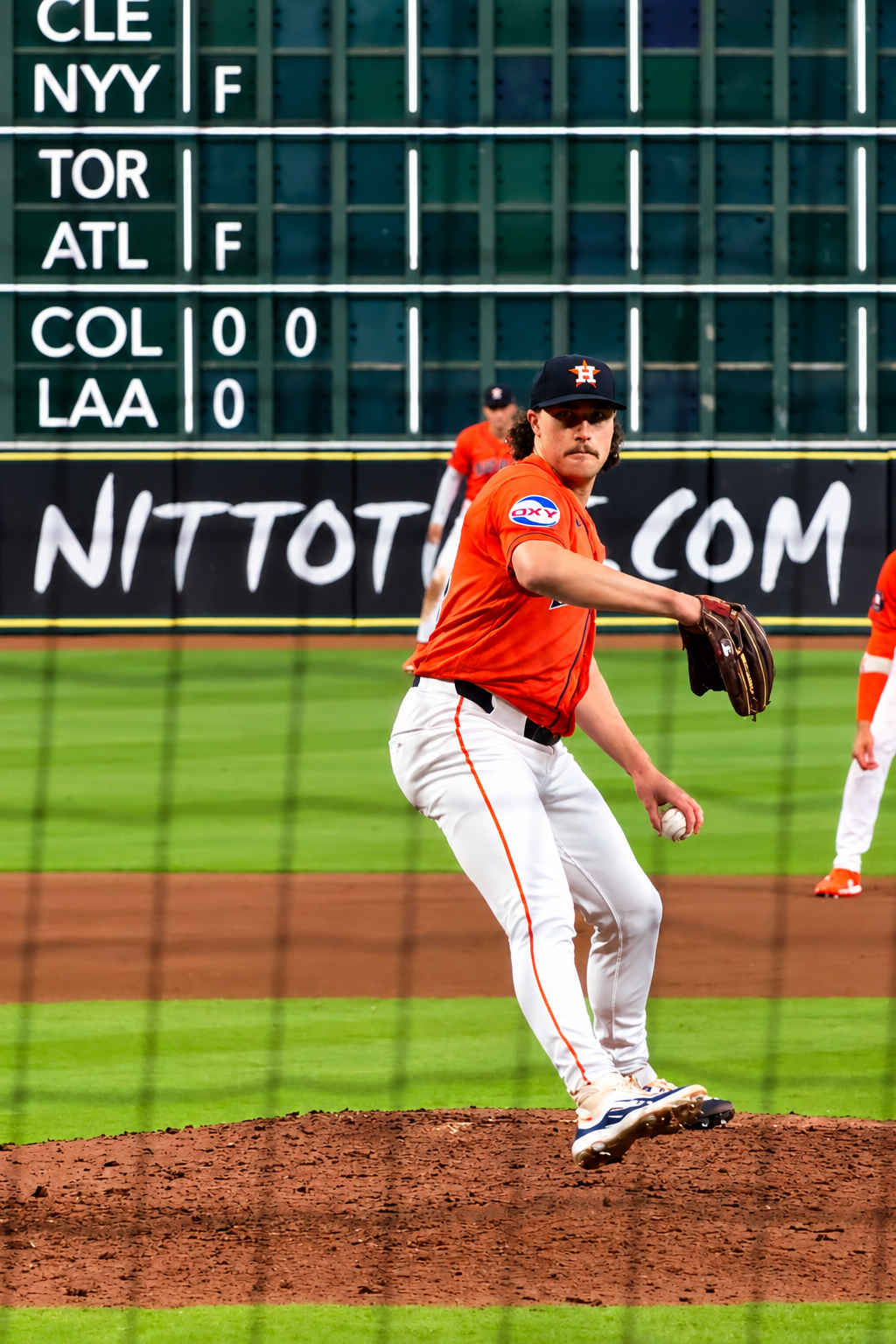 Bryan King delivers a pitch for the Astros at Daikin Park.