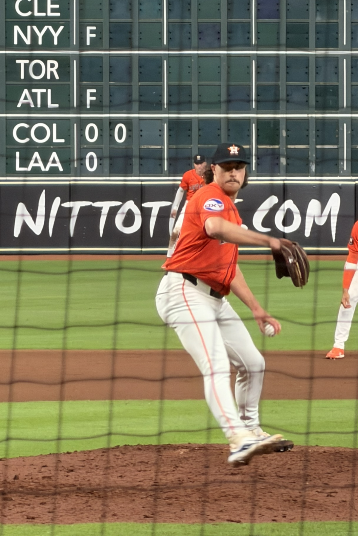 Bryan King delivers a pitch for the Astros at Daikin Park.