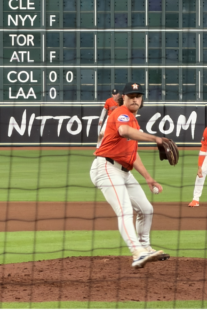 Bryan King delivers a pitch for the Astros at Daikin Park.