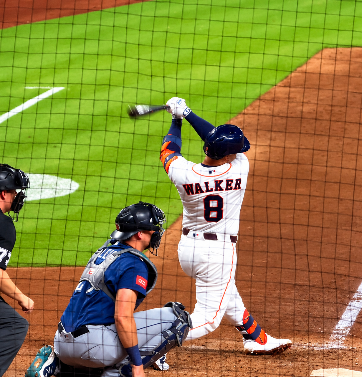 Christian Walker follows through on a swing at Daikin Park.