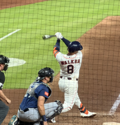Christian Walker follows through on a swing at Daikin Park.