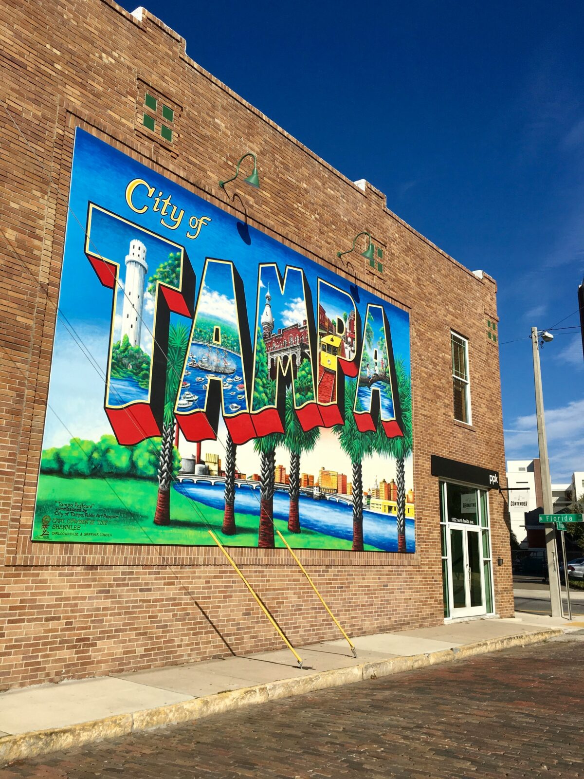 Colorful City of Tampa mural painted on the side of a brick building in Tampa, Florida.