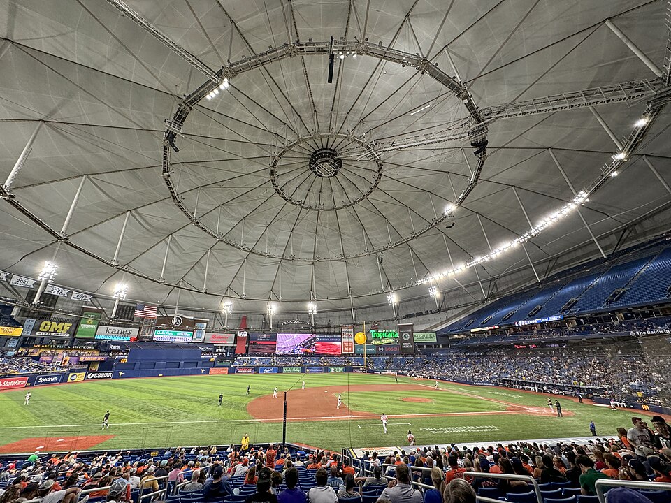 Interior of Tropicana Field during a baseball game, showing the field, stands, and domed roof.