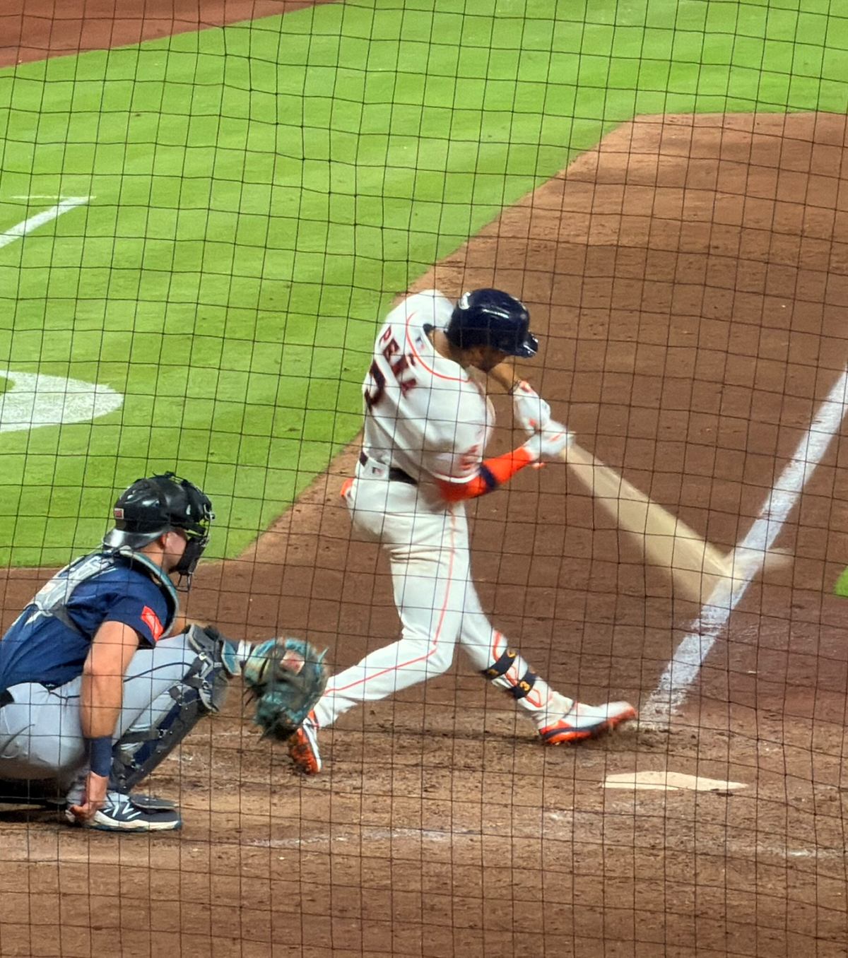Jeremy Peña makes contact at the plate at Daikin Park.