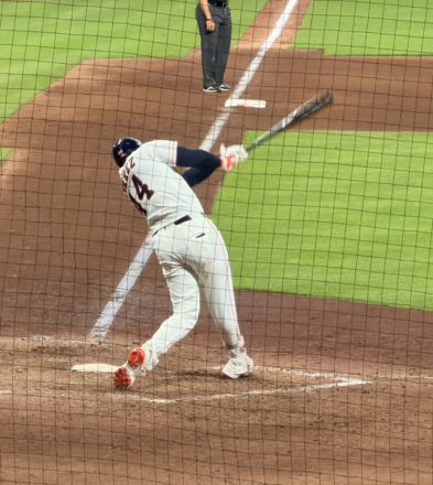 Yordan Alvarez follows through on a swing at Daikin Park.