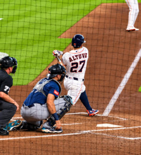 Jose Altuve follows through on a swing during an Astros game at Daikin Park.