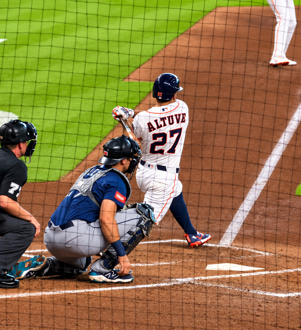 Jose Altuve follows through on a swing during an Astros game at Daikin Park.