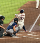 Jose Altuve follows through on a swing during an Astros game at Daikin Park.