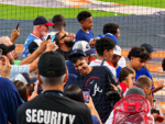 Mauricio Dubón smiles and greets fans at Daikin Park during his return to Houston with the Atlanta Braves.
