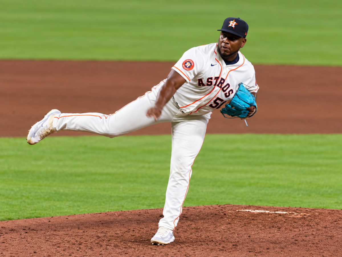 Astros pitcher Ronel Blanco follows through after delivering a pitch from the mound.