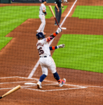 Taylor Trammell finishes his swing as his bat cuts through the air during an Astros game at Daikin Park.
