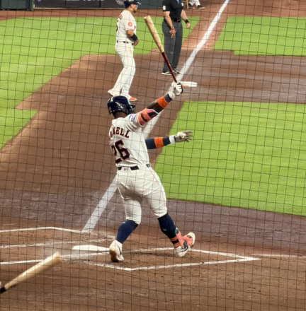 Taylor Trammell finishes his swing as his bat cuts through the air during an Astros game at Daikin Park.