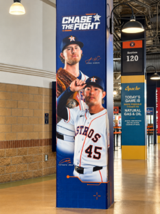 Tatsuya Imai and Josh Hader pictured on a Chase the Fight column display near Section 120 at Daikin Park.