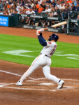Astros right fielder Cam Smith follows through on a swing at Daikin Park, photographed from behind home plate.