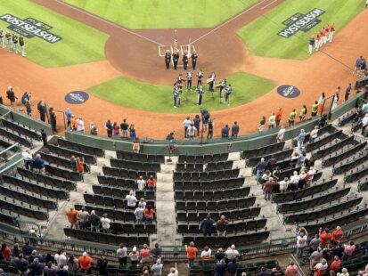 Empty seats behind home plate at Daikin Park during a pregame ceremony for the Houston Astros' 2026 Wild Card Series.